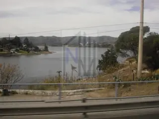 LOTE EN VILLA CARLOS PAZ APTO EMPRENIMIENTO foto 2