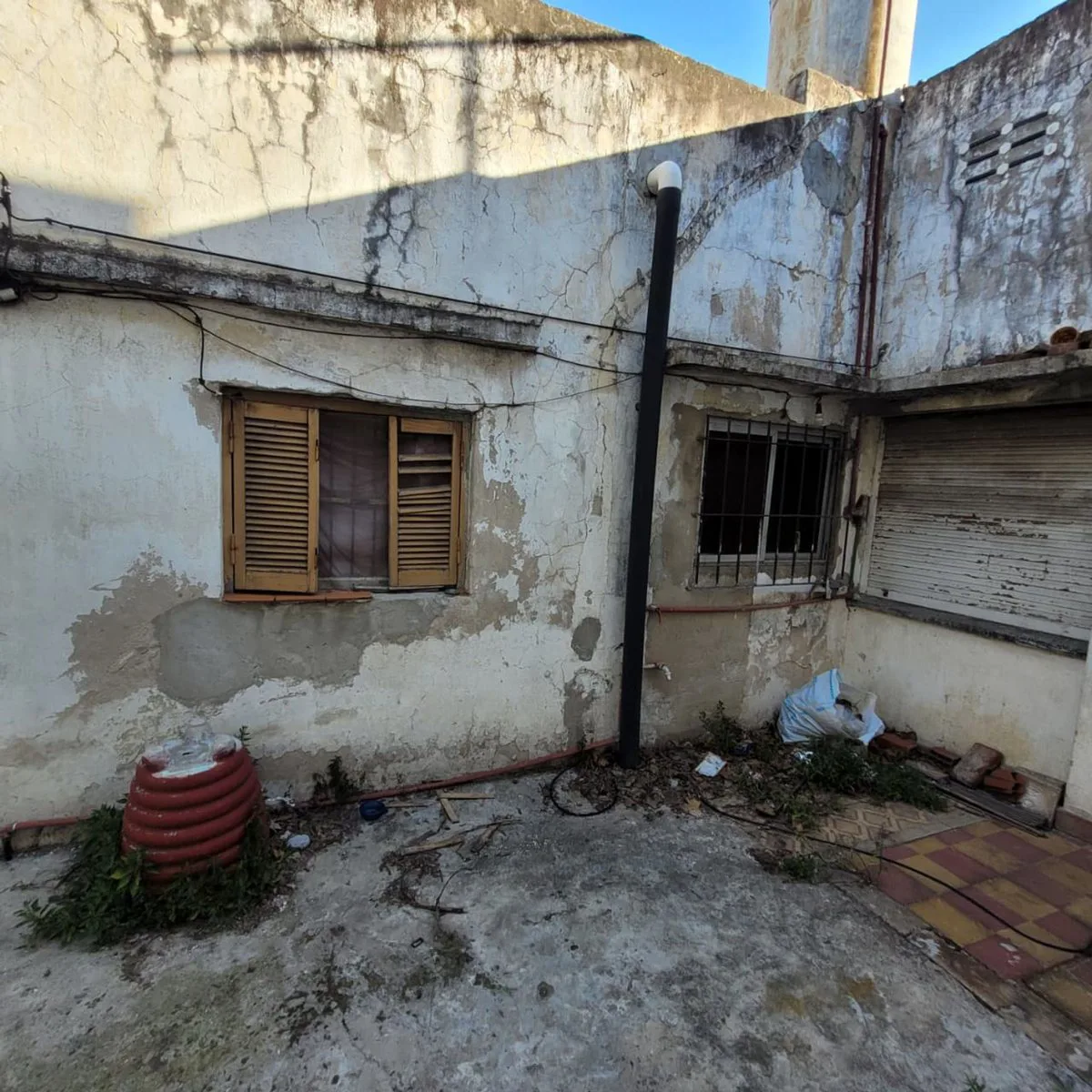 LOTE  CON CASA A DEMOLER foto 3