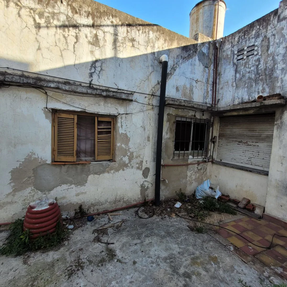 LOTE  CON CASA A DEMOLER foto 5