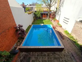 Casa 6 amb con pileta, quincho, jardín y cochera foto 1