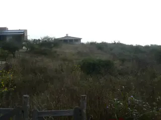 VENDO TERRENO CON DOS CABAÑAS A TERMINAR foto 1