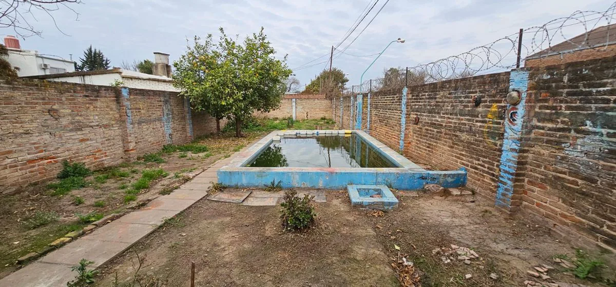 Casa mas terreno ideal para inversión foto 4